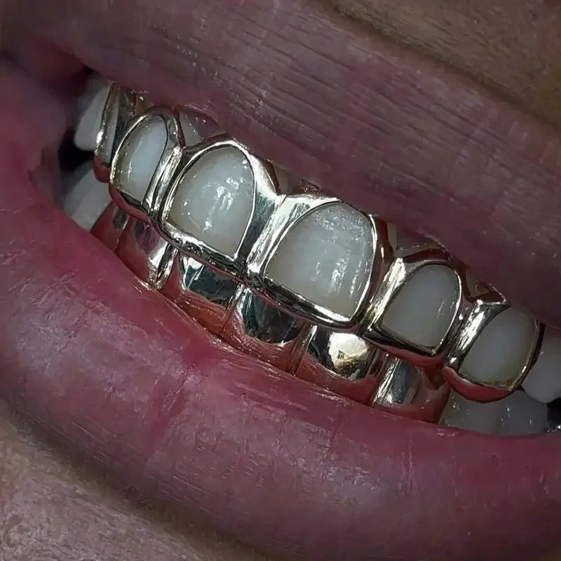 Un conjunto de adornos de dientes de Hip-Hop, accesorios de escenario y regalos de Festival, ahuecados/lisos de seis dientes a la moda